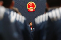 A judge announces a commutation sentence at the Hongshan Prison in Wuhan, Hubei Province, on Dec. 10, 2004. 