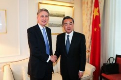 Chinese Foreign Minister Wang Yi with British counterpart Philip Hammond in last year's meeting in the U.K.
