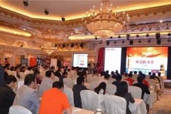 Investors and businessmen attend a domain name auction in Beijing in May.