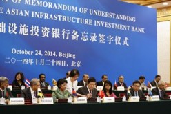 Representatives of member countries of the AIIB sign a Memorandum of Understanding in Oct. 2014.