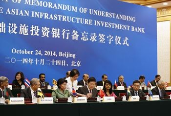 Representatives of member countries of the AIIB sign a Memorandum of Understanding in Oct. 2014.