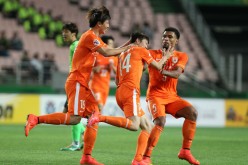 Shandong Luneng players celebrate a goal during last season's AFC Champions League qualifiers.