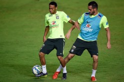 Brazil international Renato Augusto (R) with Brazil team captain Neymar in training. Augusto was recently signed by CSL club Beijing Guoan.