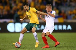 Australia center back Trent Sainsbury (L) in action during the 2018 FIFA World Cup qualifiers.