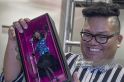Mattel Toys designer for the Barbie Collection Carlyle Nuera holds the new Claudette Gordon Barbie doll from the Harlem Theatre Series.