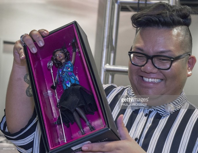 Mattel Toys designer for the Barbie Collection Carlyle Nuera holds the new Claudette Gordon Barbie doll from the Harlem Theatre Series.