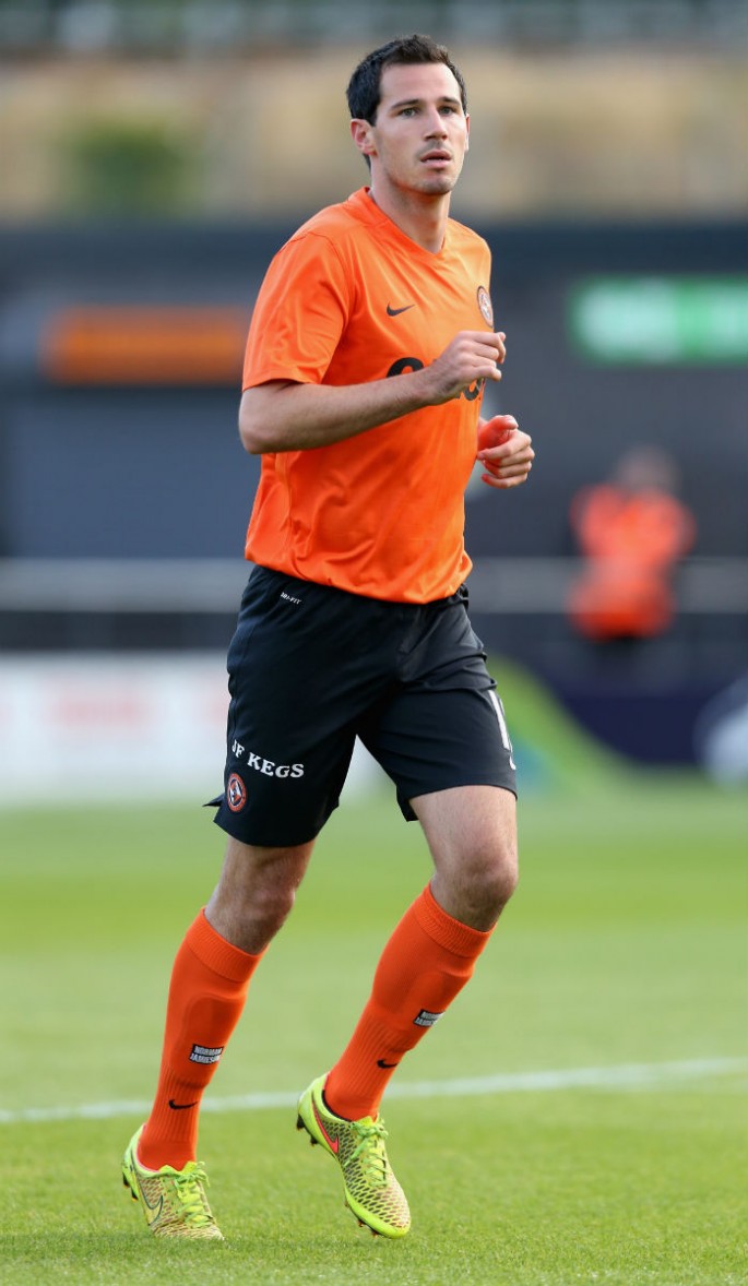 Former Dundee United defender Ryan McGowan signs with CSL club Henan Jianye.