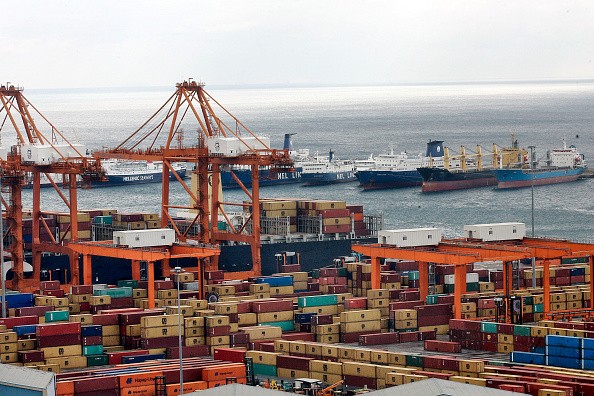 Shipping container cranes line the Pireaus cargo port in Pireaus, Greece, on Feb. 11, 2015. 