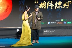 Director and actor Stephen Chow and singer Karen Mok attend the release conference for the promotional song of Chow's film 