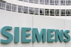 A Siemens logo is pictured on an office building of Siemens AG in Munich, May 30, 2014. 