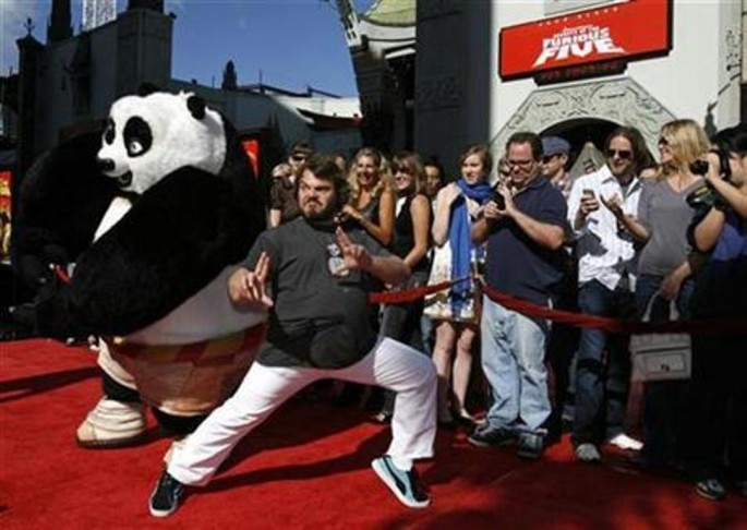 Cast member Jack Black poses with a panda character during the DVD release of "Kung Fu Panda" at the Grauman's Chinese Theatre in Hollywood, California, Nov. 9, 2008. 