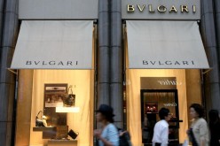  People walk by a Bulgari boutique in the Ginza district of Tokyo, Japan, on July 10, 2009.