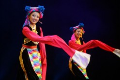Members of a performance troupe from Sichuan Province perform Tibetan folk dance in Beijing, China, on June 14, 2008.