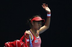 Zhang Shuai waves to her fans after losing to Konta.