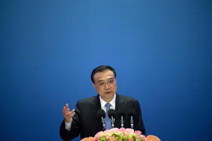 Chinese Premier Li Keqiang speaks during the Inaugural Meeting of the Board of Governors of the Asian Infrastructure Investment Bank (AIIB) in Beijing, China, Jan. 16, 2016. 