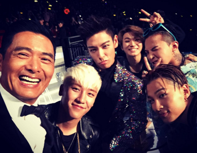 "Crouching Tiger, Hidden Dragon" star Chow Yun-Fat takes a selfie with K-Pop boy group Big Bang members G-Dragon, T.O.P, Taeyang, Daesung and Seungri.