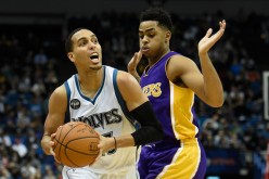 Minnesota Timberwolves shooting guard Kevin Martin (L) drives past Los Angeles Lakers' D'Angelo Russell.