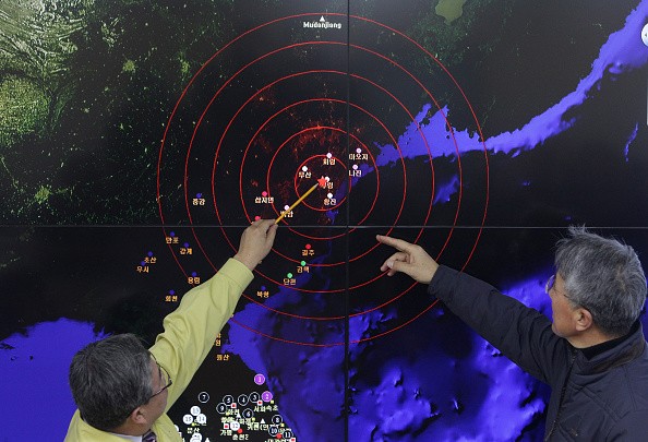 Scientists from the Korea Meteorological Administration point at the screen showing seismic waves near Seoul, South Korea, caused by a North Korean hydrogen bomb test on Jan. 6, 2016. 