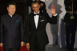 Chinese President Xi Jinping and U.S. President Barack Obama pose for photographers on the North Portico ahead of a state dinner at the White House, Sept. 25, 2015.