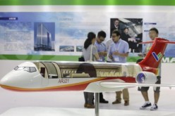 A model of the ARJ21 regional jet from Commercial Aircraft Corp. of China (COMAC) is displayed at the Aviation Expo China 2015 in Beijing, China, Sept. 16, 2015.