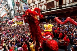 A lion dancer marks the celebrations of the Chinese Lunar New Year. 