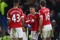 Manchester United winger Jesse Lingard celebrates his goal with teammates against Chelsea.