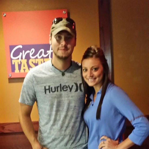 Jeremy Calvert and Brooke Wehr pose for a photo during a dinner date.