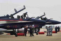 Pilots climb out of J-10 fighter jets after an exhibition during the China International Aviation & Aerospace Exhibition in Zhuhai, Guangdong Province, in Nov. 2014.
