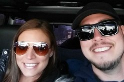 Brooke Wehr and Jeremy Calvert pose for a car selfie during a road trip.