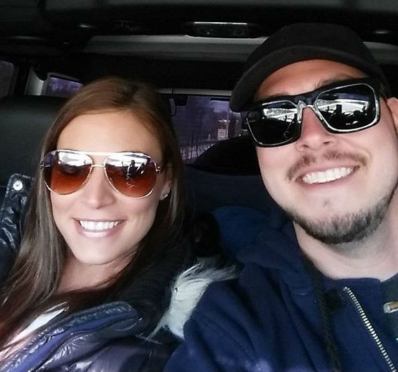 Brooke Wehr and Jeremy Calvert pose for a car selfie during a road trip.