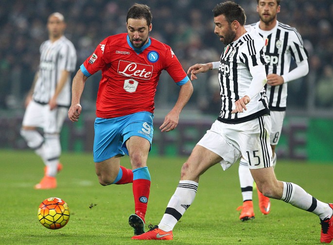 Napoli striker Gonzalo Higuaín (in red shirt) in action against Juventus.