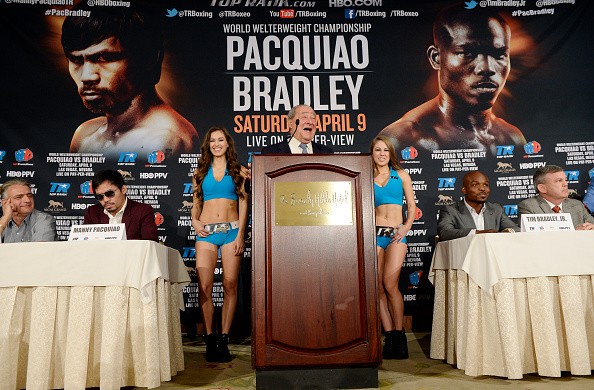 Bob Arum (center) says Manny Pacquiao-Timothy Bradley fight will go on as planned.