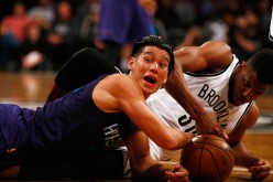 Jeremy Lin (left) and Thaddeus Young of the Brooklyn Nets battle for the ball during their game on Feb. 21 at the Barclays Center.