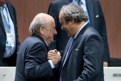 FIFA President Joseph S. Blatter (L) shakes hands with UEFA president Michel Platini during the 65th FIFA Congress at Hallenstadion on May 29, 2015 in Zurich, Switzerland.