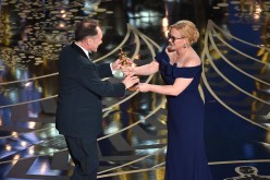 Mark Rylance accepts the Best Supporting Actor award for 'Bridge of Spies' from Patricia Arquette onstage during the 88th Annual Academy Awards at the Dolby Theatre in Hollywood, California.