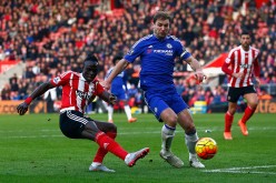 Chelsea defender Branislav Ivanovic (R) competes for the ball against Southampton's Sadio Mané.