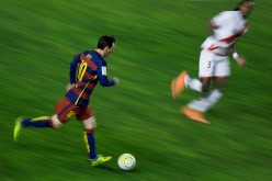 Barcelona forward Lionel Messi (L) scored a hat trick in the team's record-breaking 5-1 demolition of Rayo Vallecano.