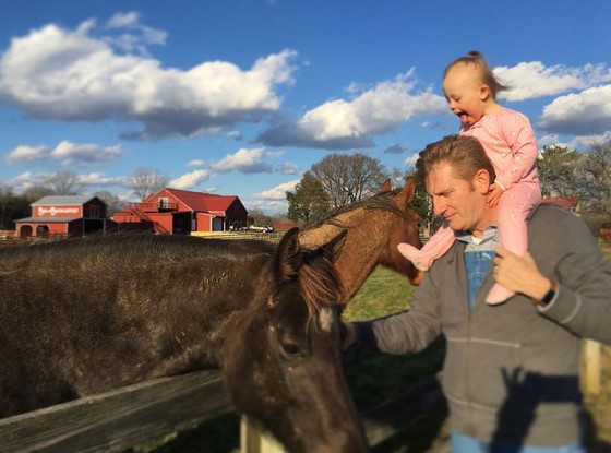 Seen here are Rory Feek along with his toddler daughter. Rory founded a duo with his wife Rory Feek called Joey+Rory and released several hits including "Cheater, Cheater." Rory died on March 4, 2016.