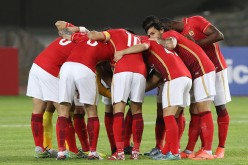 CSL club Guangzhou Evergrande huddles before a recent game in the AFC Champions League group stage.