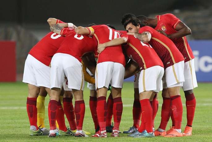 CSL club Guangzhou Evergrande huddles before a recent game in the AFC Champions League group stage.