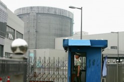 A policeman guards the entrance of a nuclear power plant in Qinshan of Hangzhou City, Zhejiang Province, China, on June 10, 2005. 