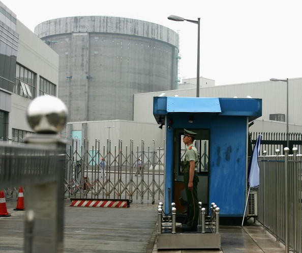 A policeman guards the entrance of a nuclear power plant in Qinshan of Hangzhou City, Zhejiang Province, China, on June 10, 2005. 