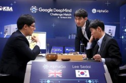 Lee Se-dol reviews the match after winning the fourth match over Google's artificial intelligence program AlphaGo in the Google DeepMind Challenge Match in Seoul, South Korea, on March 13.