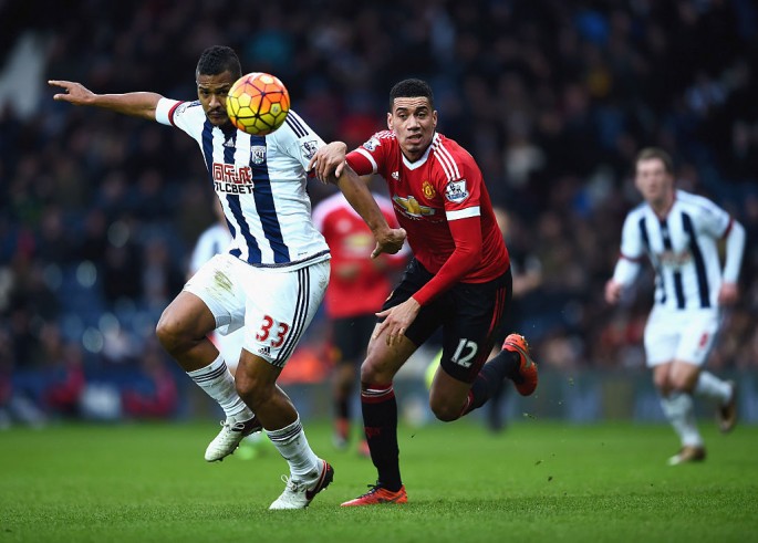 West Brom striker Salomón Rondón (L) competes for the  ball against Manchester United's Chris Smalling.