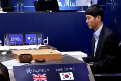 South Korean professional Go player Lee Se-dol prepares for his next move against Google's AI program, AlphaGo, during the Google DeepMind Challenge Match in Seoul, South Korea, on March 10, 2016. 