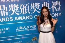 South Korean singer Jessica Jung poses after the 2013 Huading Awards Ceremony at The Venetian in Macau.