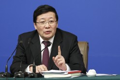 Finance Minister Lou Jiwei is unfazed by downgraded rating on China's economy.