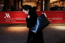 A woman walks by a Marriott hotel in midtown Manhattan in New York City on March 21, 2016.