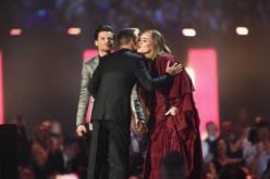 Adele receives her Best British Female Solo Artist award on stage from presenters Liam Payne and Louis Tomlinson at the BRIT Awards 2016 in London, England. 