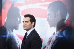 Henry Cavill posing during the red carpet premiere of 